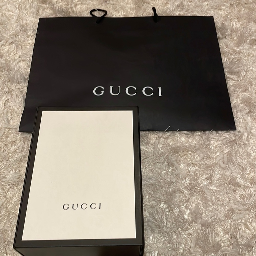 Empty authentic Gucci box and shopping bag
